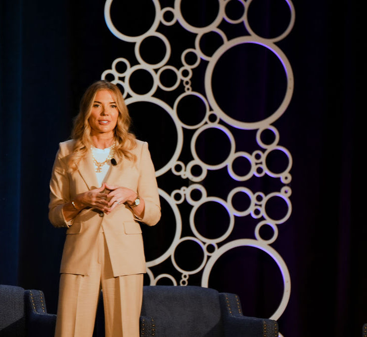 Heidi Arndt speaking to a conference audience